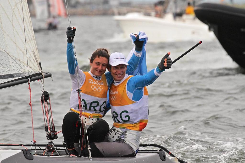 Santiago Lange and Cecilla Saroli (ARG) celebrate after winning the Gold Medal in the  Nacra 17 Medal race. Summer Olympics © Richard Gladwell www.photosport.co.nz